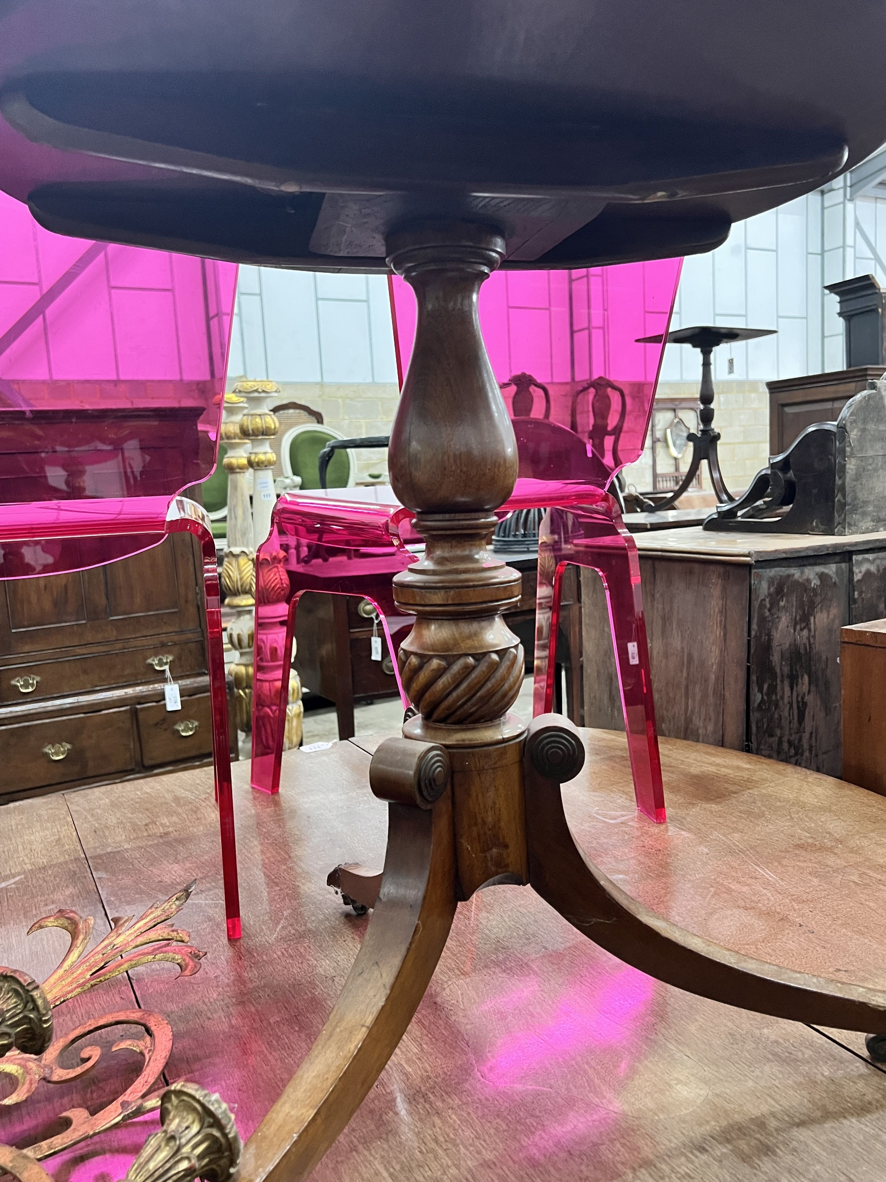 A Regency circular mahogany tilt top tripod tea table, diameter 63cm, height 71cm